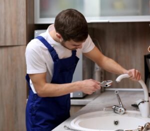 plumber installing a faucet