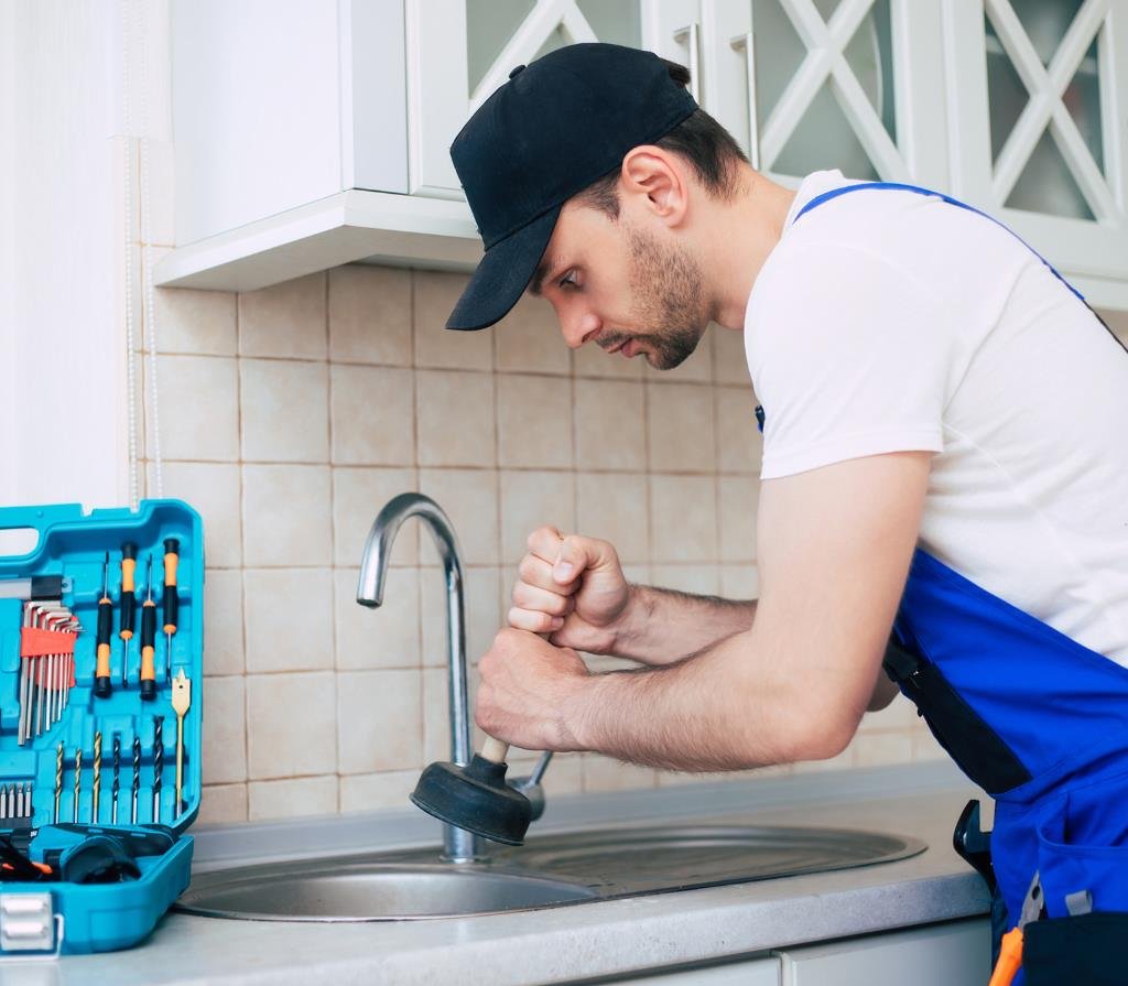 plumber repairing a faucet