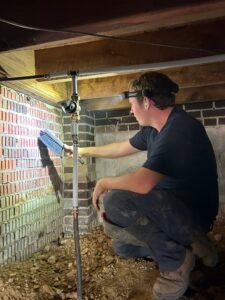 plumber detecting a leak