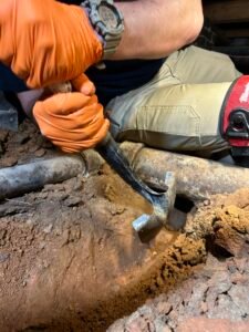 plumber fixing a pipe