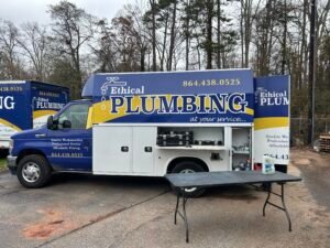 plumbers coming out of the ethical plumbing van