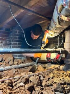 plumber installing a water line