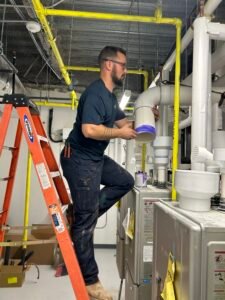 plumber fixing a water line