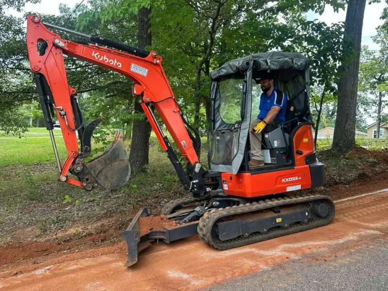 Mini excavator trenching for a main water line