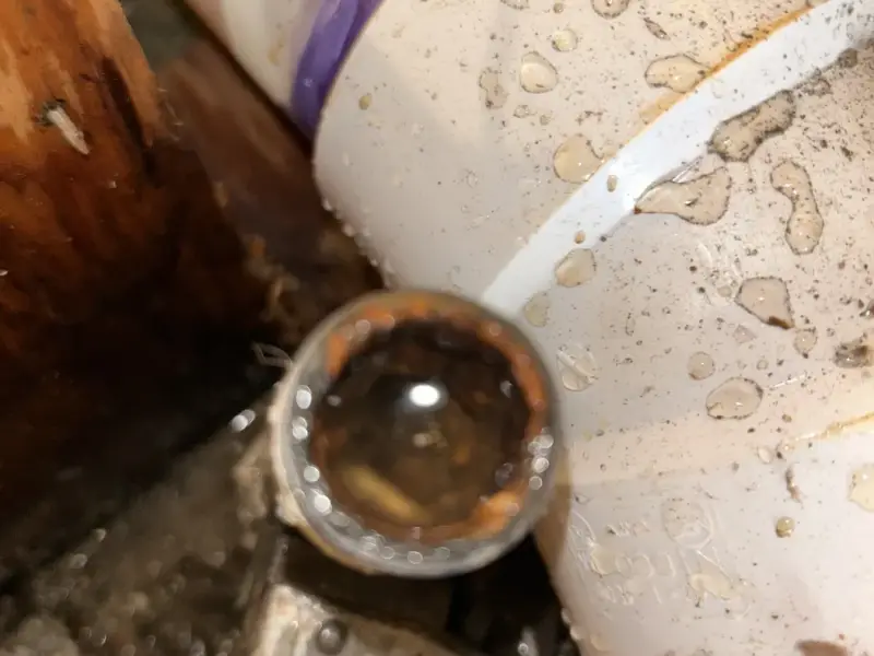 Old cast iron drain connected to new PVC during a reroute