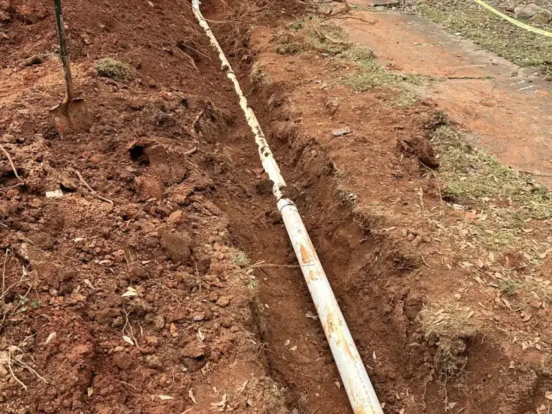 New PVC sewer lateral laid in an open trench