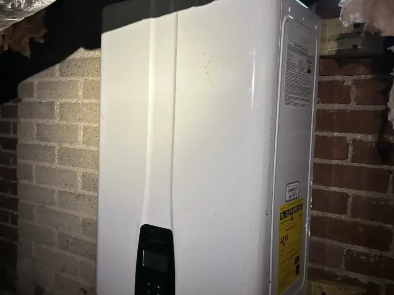 Navien tankless water heater installed in a crawl space