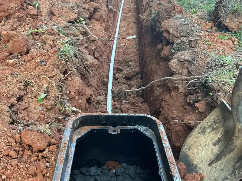 New water service line in a trench leading to the meter box
