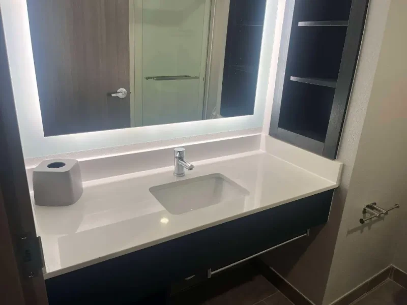 Hotel guest bathroom vanity after a plumbing renovation