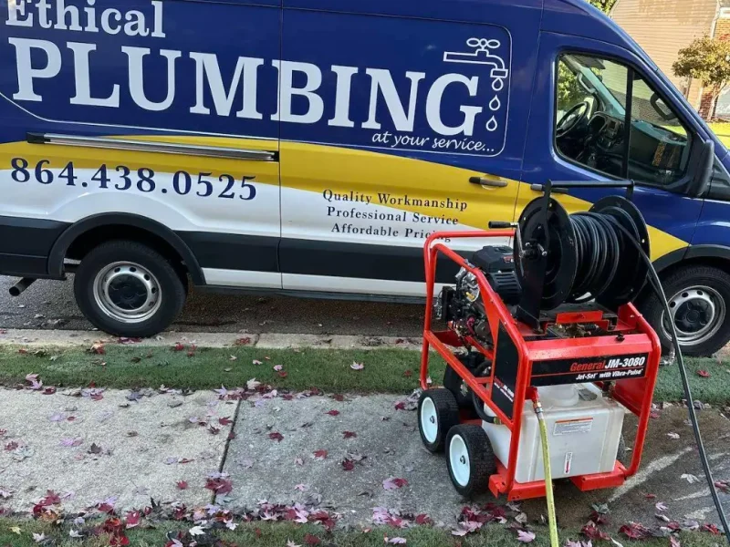 Hydro jetting machine beside an Ethical Plumbing van
