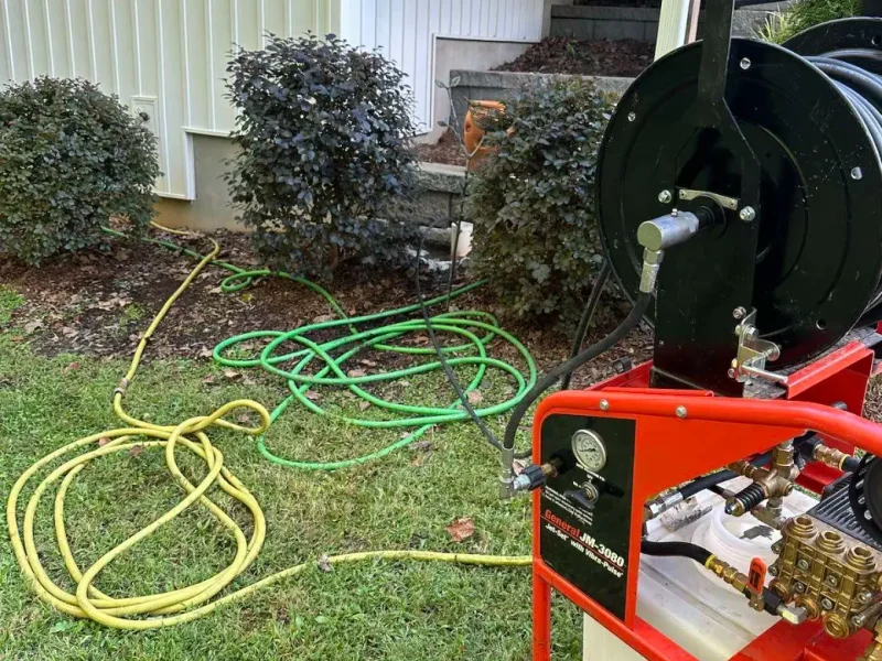 Hydro jetter and hose reel set up at a home