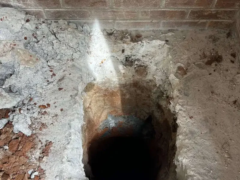 Leak spraying up from a hole at the foundation, Ethical Plumbing