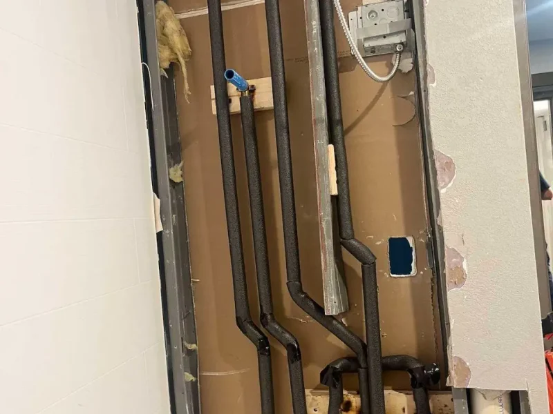 New water lines in an open wall during a repipe