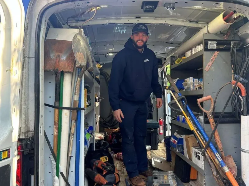 Plumber in a fully stocked Ethical Plumbing service van