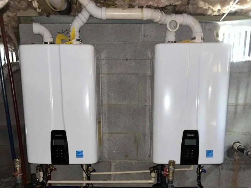 Two tankless water heaters installed side by side